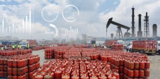 LPG gas cylinders stacked at an Indian distribution center as the government revises natural gas allocation to secure domestic LPG supply.