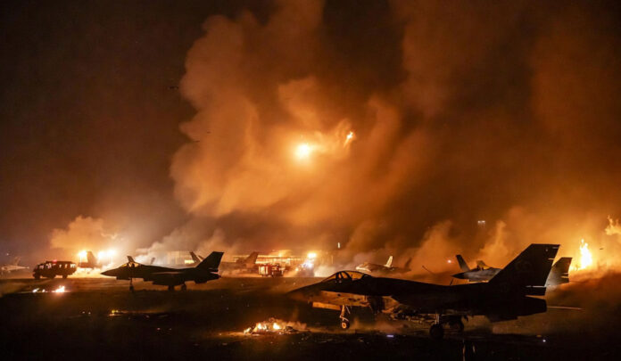 iran-attack-prince-sultan-a Missile and drone attack on Prince Sultan Air Base in Saudi Arabia with damaged aircraft and smoke
