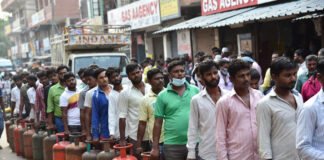 People waiting in line for LPG gas cylinders amid shortage and price hike concerns in India