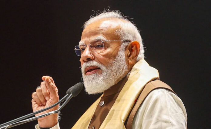 pm-modi-namo-app-assam-pudu Prime Minister Narendra Modi