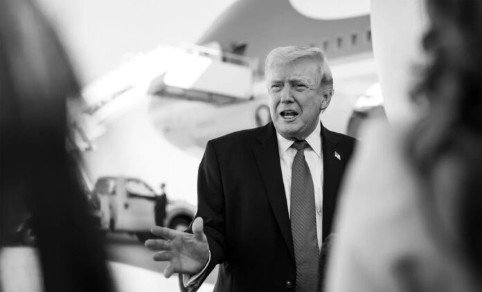 trump-iran-market-insider-t Donald Trump with stock market charts showing sharp movements amid Iran-related announcement