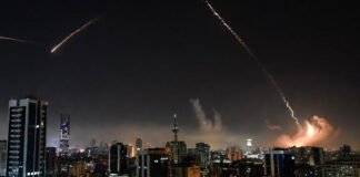 Missile trails over a Middle Eastern city skyline during escalating Iran-Israel conflict impacting global oil prices and markets