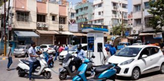 Electric vehicles in India including scooters and cars showing sales growth 2026