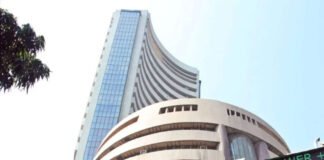 Bombay Stock Exchange building with rising stock market data showing Sensex rally