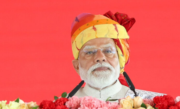 Narendra-Modi Prime Minister Narendra Modi addressing a large rally in Cooch Behar, West Bengal