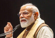 PM Modi Targets TMC in Bengal Rally, Calls for Change Prime Minister Narendra Modi addressing a massive election rally in West Bengal