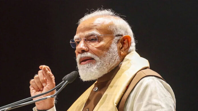 PM Modi Targets TMC in Bengal Rally, Calls for Change Prime Minister Narendra Modi addressing a massive election rally in West Bengal