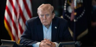 Donald Trump announcing tariffs on countries supporting Iran at White House