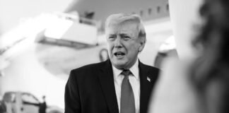 Donald Trump speaking amid Iran war tensions and MAGA backlash