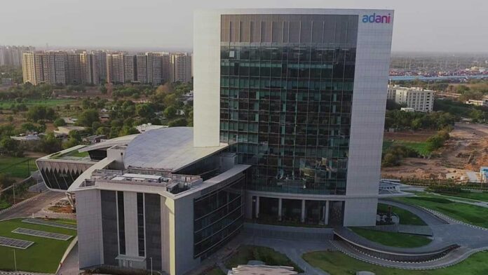 Adani Enterprises Q4 FY26 loss and infrastructure investments Adani Enterprises infrastructure projects including airport and industrial facilities showing financial performance impact