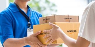 Amazon India warehouse with workers sorting packages using automated conveyor systems and AI logistics technology