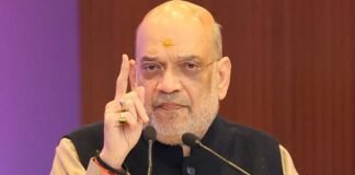 Amit Shah addressing a political rally in West Bengal with large crowd