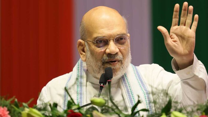 Amit Shah Darjeeling Rally 2026 Amit Shah addressing a large BJP rally in Darjeeling with crowd and party flags