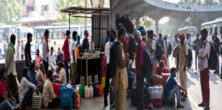 Delhi gas crisis kerosene stove demand migrant workers leaving Anand Vihar bus station 2026