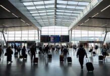 France Waives Transit Visa for Indian Flyers in Major Travel Boost from April 2026 Indian passengers walking through Paris airport transit terminal after France removes transit visa requirement