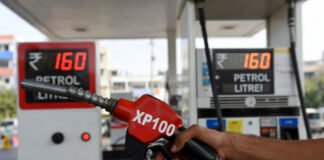 XP100 petrol price ₹160 per litre in Delhi with premium fuel pump and price board showing increase