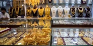 Gold and silver bars displayed in bullion market as prices surge in Delhi amid geopolitical tensions