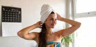 Woman washing hair in morning with natural light and calm environment