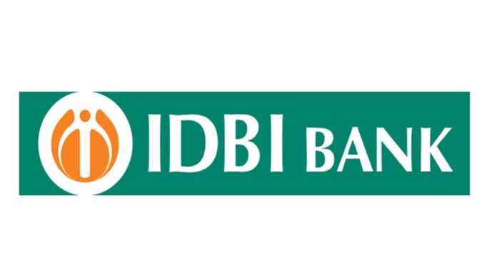 idbi-bank-q4-results-2026-p IDBI Bank branch exterior with financial charts showing Q4 FY26 results and profit decline