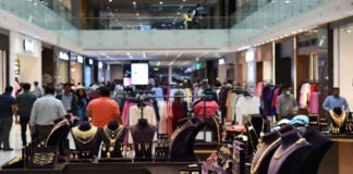 Indian shopping mall with apparel stores and jewelry outlets showing strong consumer demand amid rising costs