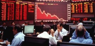 Sensex and Nifty crash with red market screen showing sharp decline amid oil price surge