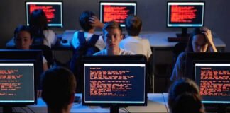 Students facing Canvas platform outage during global cyberattack with ransom message on screen
