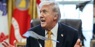 Donald Trump speaking on China AI technology theft allegations with US-China flags and digital AI graphics
