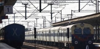 Indian Railways train arriving at Jhansi station after timing revision announcement