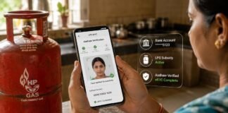 Woman using mobile phone to complete LPG gas subsidy eKYC verification online in India