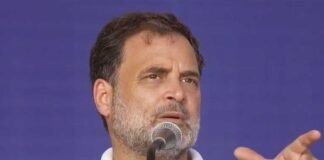 Rahul Gandhi speaking against the Modi government over the NEET paper leak controversy during a public address