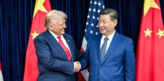 Donald Trump speaking at a podium while discussing US-China relations and criticizing the Biden administration