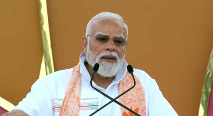 Prime Minister Narendra Modi participates in a mass yoga session during International Yoga Day 2026 celebrations at Kolkata's historic Red Road.