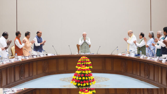 NDA Leaders Honor PM Modi for Historic 4,399-Day Record Prime Minister Narendra Modi receives a standing ovation from NDA leaders during a meeting at Bharat Mandapam in New Delhi.