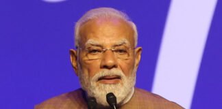 Prime Minister Narendra Modi speaks at a public event in Tarakeswar after releasing PM-KISAN financial assistance to eligible farmers