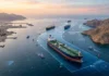 Iran-Oman Near Deal on New Hormuz Shipping Route; Strait Not Fully Reopening Yet Map showing the proposed new commercial shipping route through the Strait of Hormuz under the Iran-Oman maritime agreement.