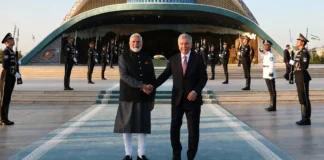 PM Narendra Modi and Uzbekistan President Shavkat Mirziyoyev shake hands during the Tashkent welcome